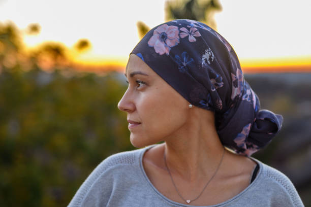 istock Courageous woman with cancer watching the sunset 1704982410