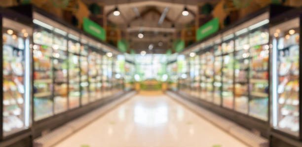 supermarket grocery store aisle and shelves blurred background - department store shopping mall store inside of imagens e fotografias de stock