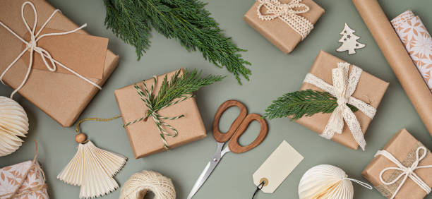 istock Christmas background with gift boxes and kraft wrapping paper. Xmas celebration, preparation for winter holidays. Festive mockup, top view, flatlay 1704991452