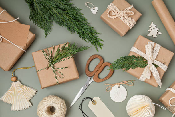 istock Christmas background with gift boxes and kraft wrapping paper. Xmas celebration, preparation for winter holidays. Festive mockup, top view, flatlay 1704991475