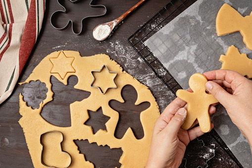 Christmas cookies baking process. Cutting buiscuits with cookies cutter. Homemade treats, diy festive dessert idea
