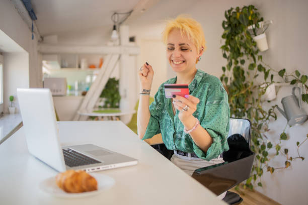 istock Happy young customer enjoys shopping online 1704993830