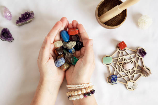 istock Healing chakra crystal grid therapy. Rituals with gemstones for wellness, healing, meditation, destress, relaxation, mental health, spiritual practices. Energetical power concept 1704997541