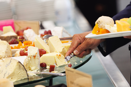 Gourmet cheese platter on a buffet at social event