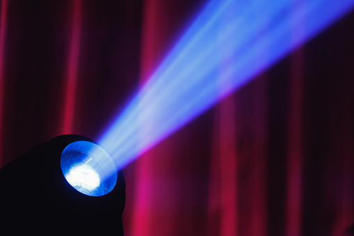 Abstract stage lighting in auditorium