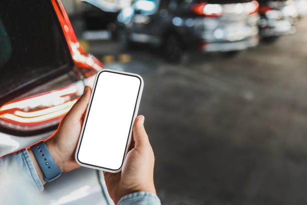 istock Phone with isolated screen on the background of a car 1705109957