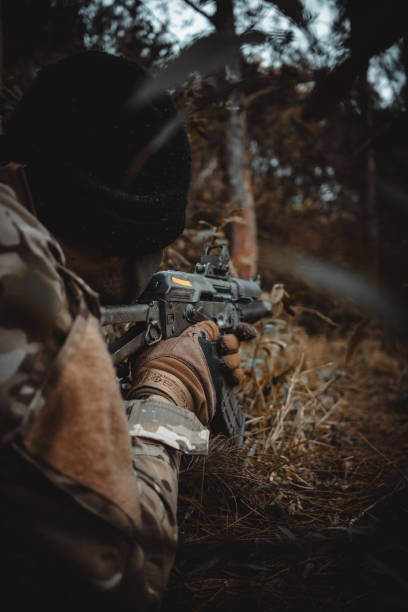 istock soldier with an ​​rifle 1705121582