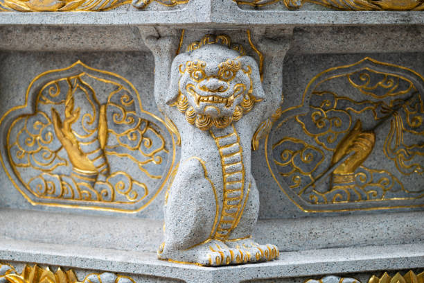 istock Stone dragon statue with golden colored ornaments in a buddhist temple 1705122162