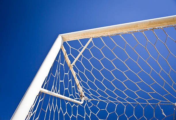 Soccer Goal Net Against Blue Sky stock photo