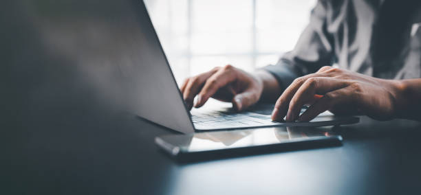 Close up of a hands on a laptop keyboard