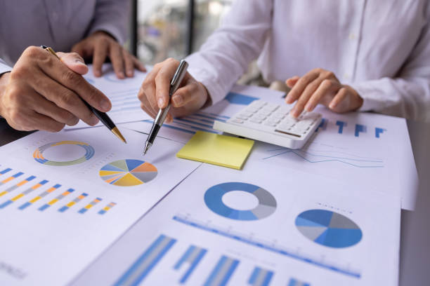 istock Team businesspeople or an accountant team are analyzing data charts, graphs, and a dashboard on a laptop screen in order to prepare a statistical report and discuss financial data in an office. 1705145146