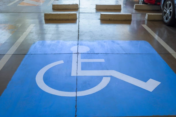 istock Preferential parking space for people with wheelchairs. accessible parking concept 1705156270