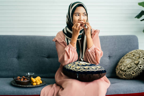 istock Healthy female eat dates fruit 1705161918