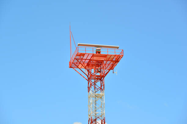 signal transmitting military antenna with tower with blue cloudy sky. - sea safety antenna radar imagens e fotografias de stock