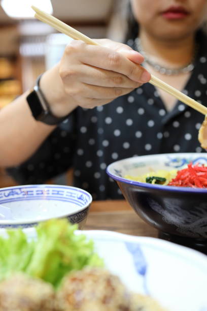 istock Eating Japanese Food 1705217382