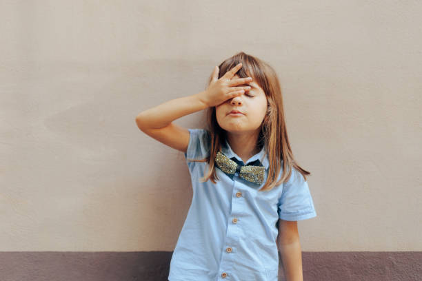 istock Stressed Little Child Making a Facepalm Gesture 1705234293