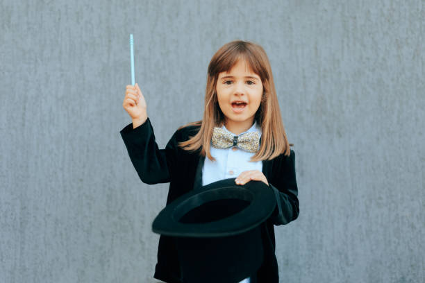 Playing dress-up these kids are portraying adults in an argument.  Stucco type wall background, she wears a dress hat with veil, he wears a tie and felt dress hat.