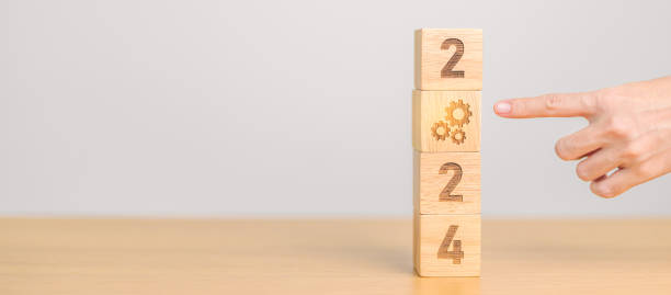 istock 2024 block with gear icon. Business Process, Team, teamwork, Goal, Target, Resolution, strategy, plan, Action, motivation, change, brainstorm and New Year start concepts 1705249273
