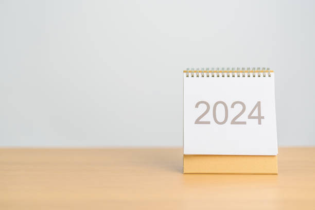 istock 2024 Year Calendar on table background. Happy New Year, Resolution, Goals, Plan,  Action, Mission and financial Concept 1705249277