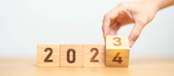 istock 2023 change to 2024 year block on table. goal, Resolution, strategy, plan, start, budget, mission, action, motivation and New Year concepts 1705249476
