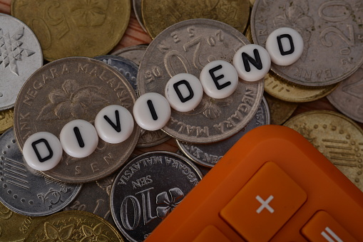 the text dividend is a payment made by a corporation to its shareholders, usually in the form of cash or additional shares of stock