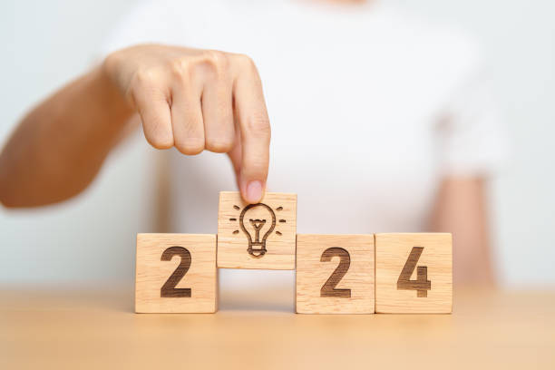 istock 2024 block with lightbulb. Business Idea, Creative, Thinking, brainstorm, Goal, Resolution, strategy, plan, Action, change and New Year start concepts 1705250349