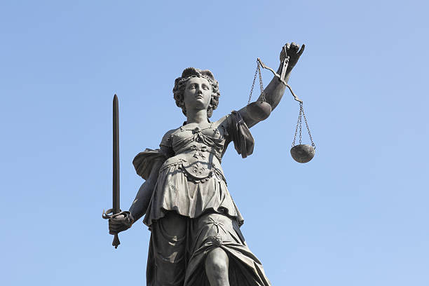 istock sword and perfect  blue sky with ancient lady Justice Justitia 170525864