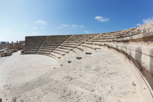 amphitheater steps against blue sky in Paphos Cyprus wide angle fish eye view