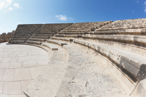 curved amphitheater steps  against blue sky in Paphos Cyprus wide angle fish eye view