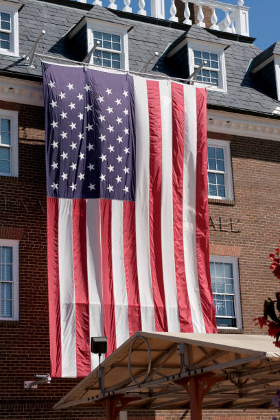 istock A large American flag flown outside a brick building 1705299638