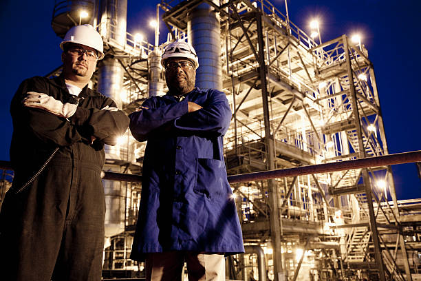 istock Chemical plant workers at night 170531414