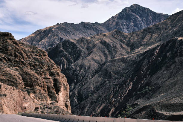 Mountain range above winding road in Tien Shan mountains