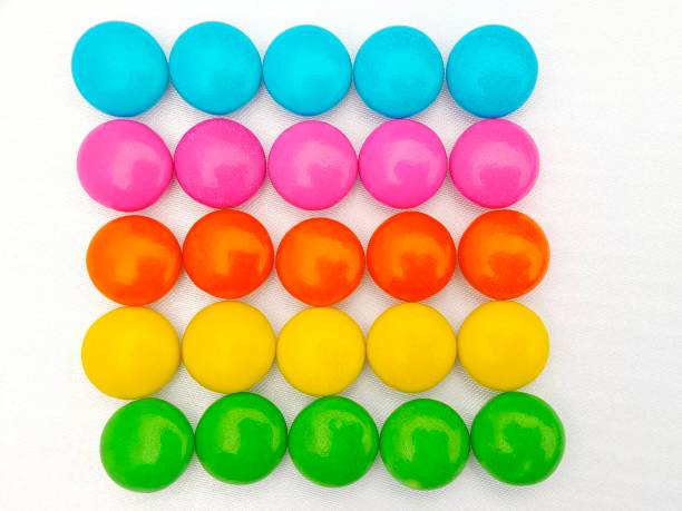 istock Selective focus of colourful chocolate candies arranged in rows isolated on white background 1705352919
