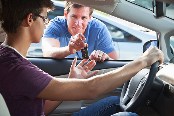 istock Father handing son car keys 170535415