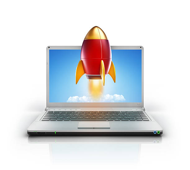 metallic stylish with speed rocket launching from laptop pc screen stock photo