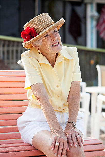 istock Senior woman sitting on bench 170536940