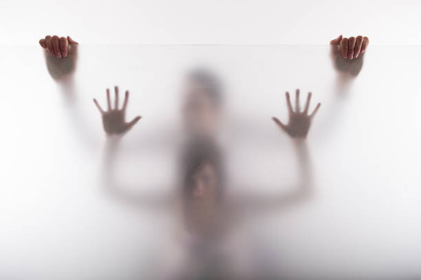 カップル窓の後ろ - trapped horror fog human hand ストックフォトと画像