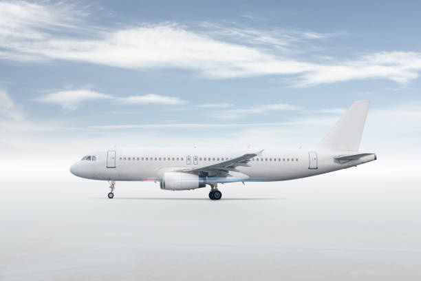 istock White passenger airliner isolated on bright background with sky 1705392865