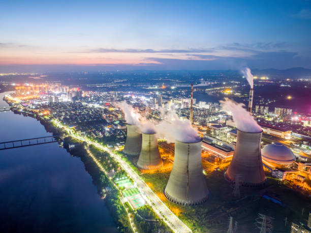 istock Thermal power plant at night, city 1705402093