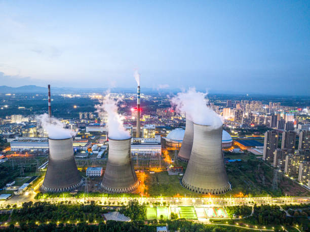 istock Thermal power plant at night, city 1705402113
