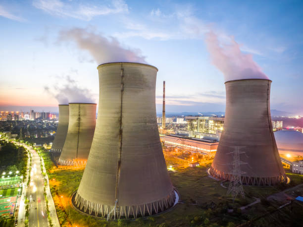 istock Thermal power plant at night, city 1705402114