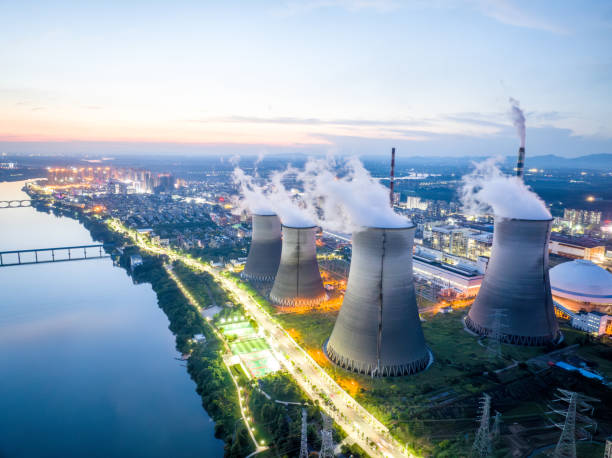 istock Thermal power plant at night, city 1705402117