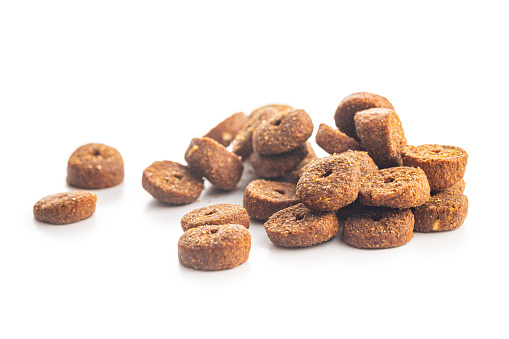 Dry animal food. Dog or cat kibble isolated on the white background.