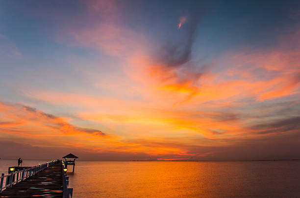 istock Wood bridge to the sea at sunset 170541520