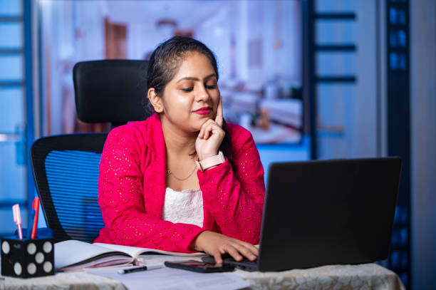 istock Young business woman doing online work on laptop at office 1705416494