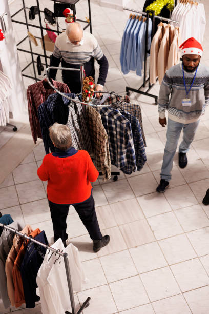 istock Various shoppers looks at clothing items 1705423273
