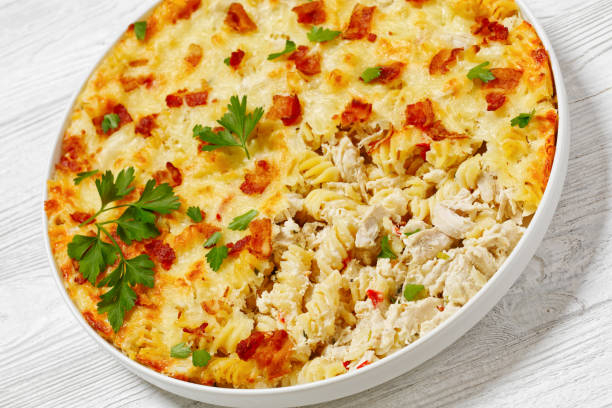 istock fusilli pasta bacon cheese chicken bake, top view 1705425131