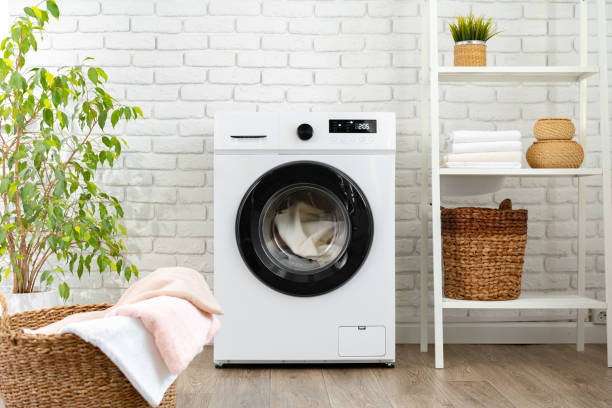 istock Modern white washing machine close up photo 1705460888