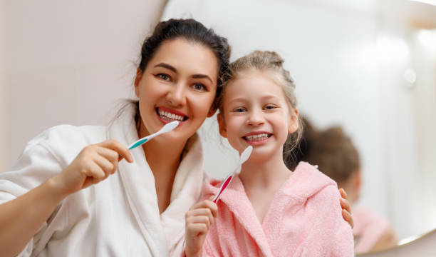 istock family are brushing teeth 1705498932