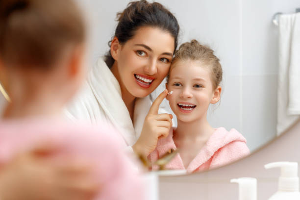 istock Mother and daughter caring for skin 1705498963